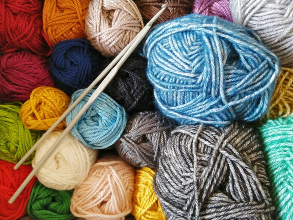 Orange, blue and white yarn, the sort of material knitters can choose with sustainability in mind